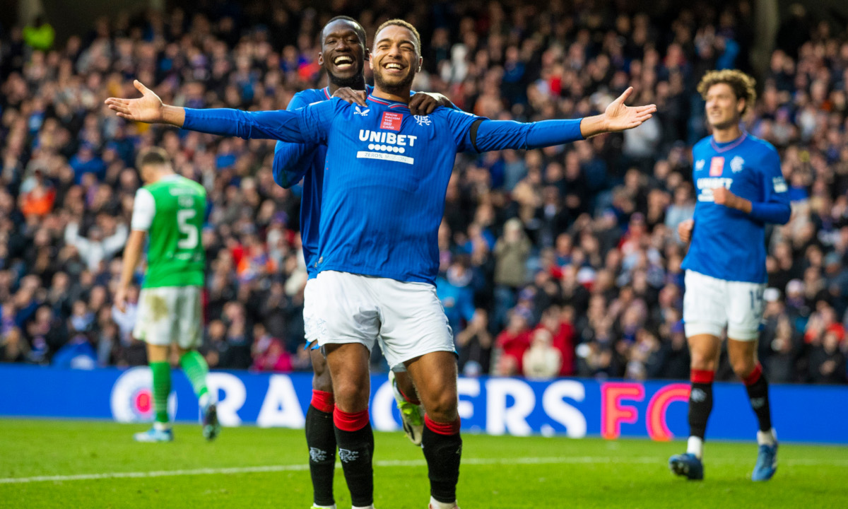 Cyriel Dessers of Rangers celebrates his goal with his team mate Abdallah Sima during the Scottish Premiership match at Ibrox Stadium, Glasgow.