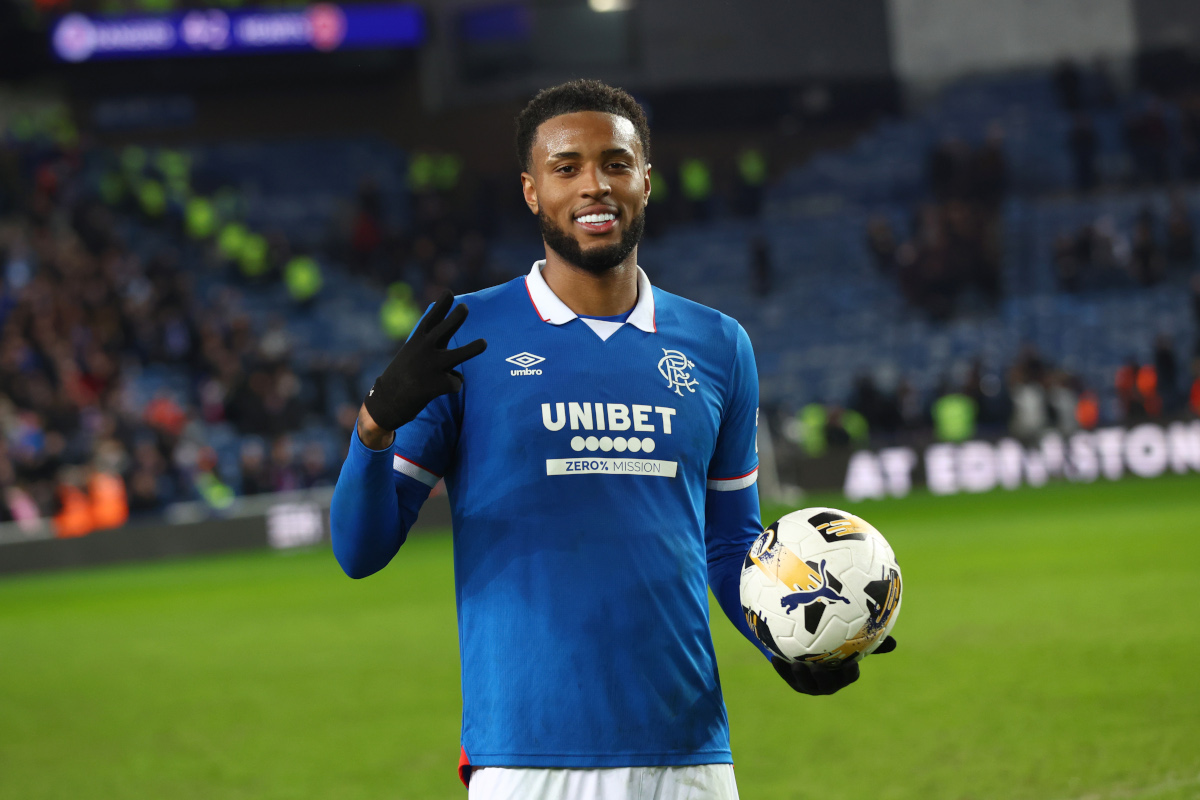 Youssef Chermiti holding the match ball after scoring a hat-trick against Hearts